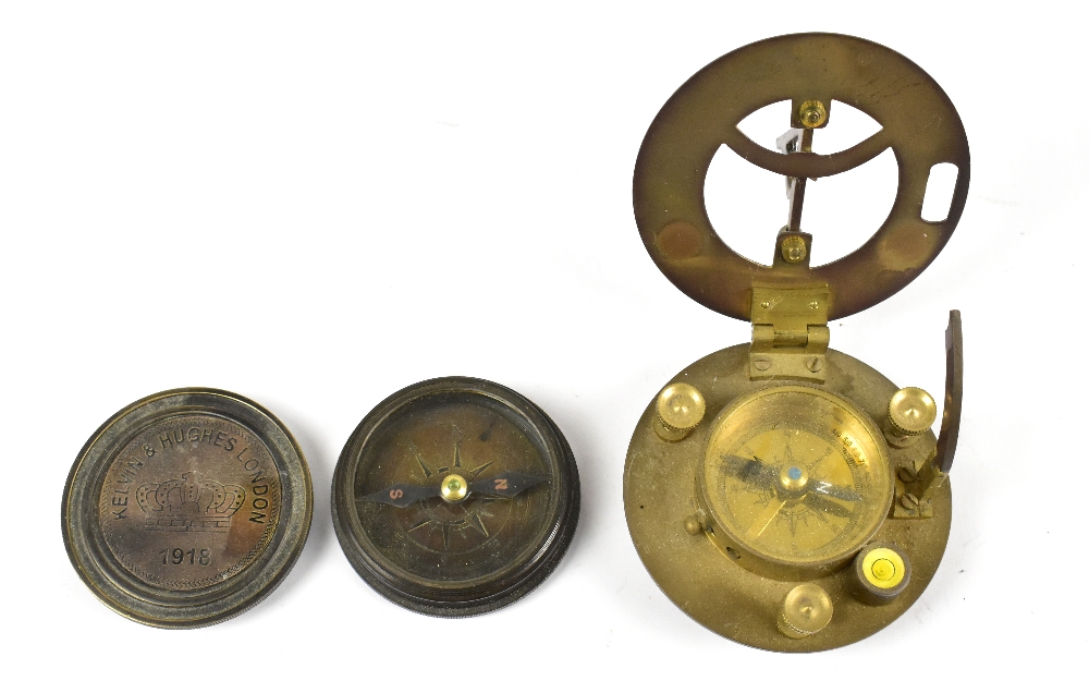 A reproduction pocket compass and a reproduction pocket sundial (2).
