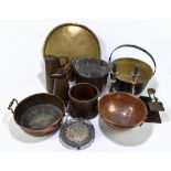 A quantity of metalware including a brass preserve pan, brass tray, embossed copper bucket, pair