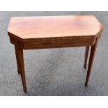 An early 19th century mahogany, crossbanded and boxwood strung card table, the canted rectangular