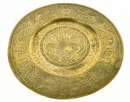 A Chinese brass charger decorated with dragons and the Pearl of Wisdom, diameter 40.5cm.