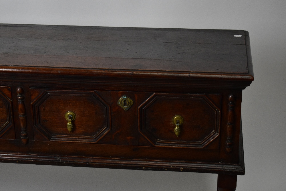 A 1920’s oak dresser base, of 17th century style, with two fielded drawers, on turned and block - Bild 4 aus 5