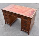 A mahogany nine drawer twin pedestal desk, length 120cm.