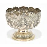 An Eastern white metal footed bowl, relief decorated with figures, unmarked, height 7.5cm, approx