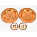 WMF; a pair of copper circular dishes embossed with Tudor Roses inside Art Nouveau flowerheads,