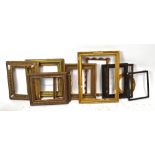 A quantity of gilt and other picture frames.