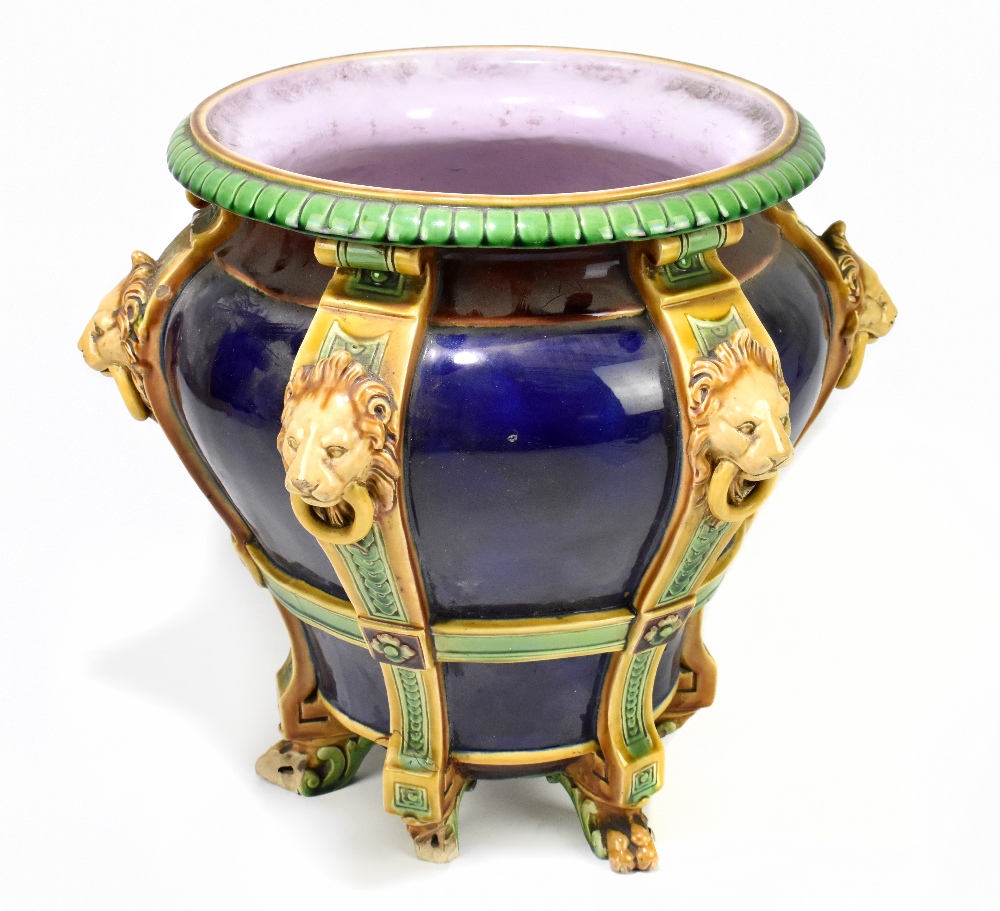 MINTON; a 19th century majolica jardinière moulded with six vertical straps, each with lion mask