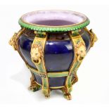 MINTON; a 19th century majolica jardinière moulded with six vertical straps, each with lion mask
