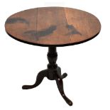 A Georgian oak tilt-top tripod table, height 71cm, diameter 84cm.