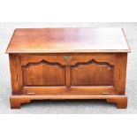 A reproduction oak media cabinet with panelled fall front, on bracket feet, width 81cm, depth