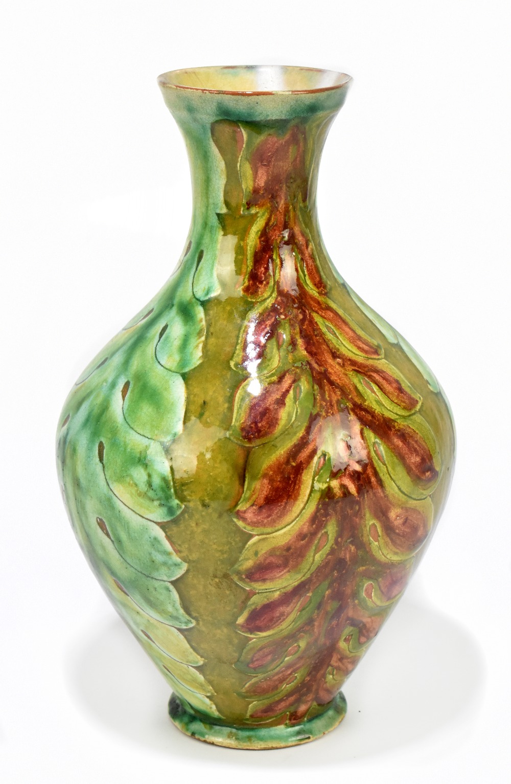 LIZZIE WILKINS FOR DELLA ROBBIA; an Art Pottery vase of belly form with stylised floral detail,