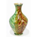 LIZZIE WILKINS FOR DELLA ROBBIA; an Art Pottery vase of belly form with stylised floral detail,