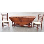 A large reproduction oak oval gateleg dining table or wake table on bobbin turned twin gateleg