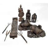A group of wooden carved Oriental figures in various styles.