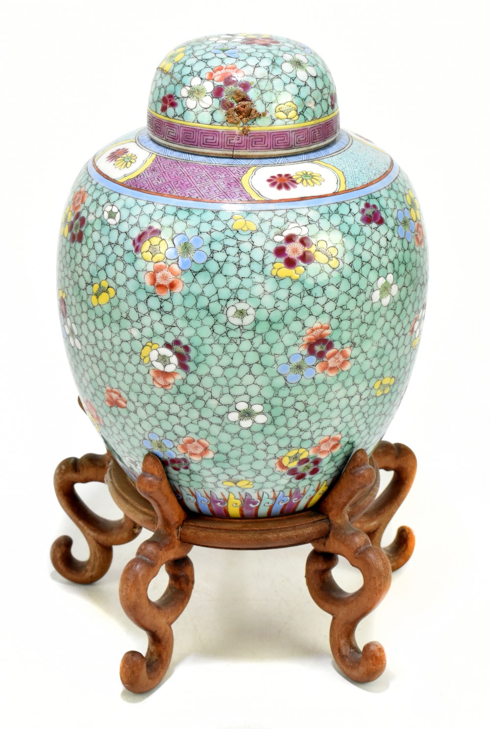 A late 19th century Chinese Famille Rose jar and cover, enamel painted with floral sprays on a