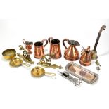 An assortment of metalware including copper haystack jugs, pair of brass chamber sticks, etc.