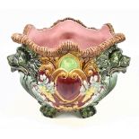 A 19th century Continental majolica jardinière relief moulded with three lion mask heads and
