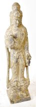 A large carved stone figure of Guanyin, on lotus leaf base, height 105cm.  Provenance: private