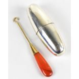 A Continental yellow metal and orange agate sewing/button hook, length 7cm, together with a