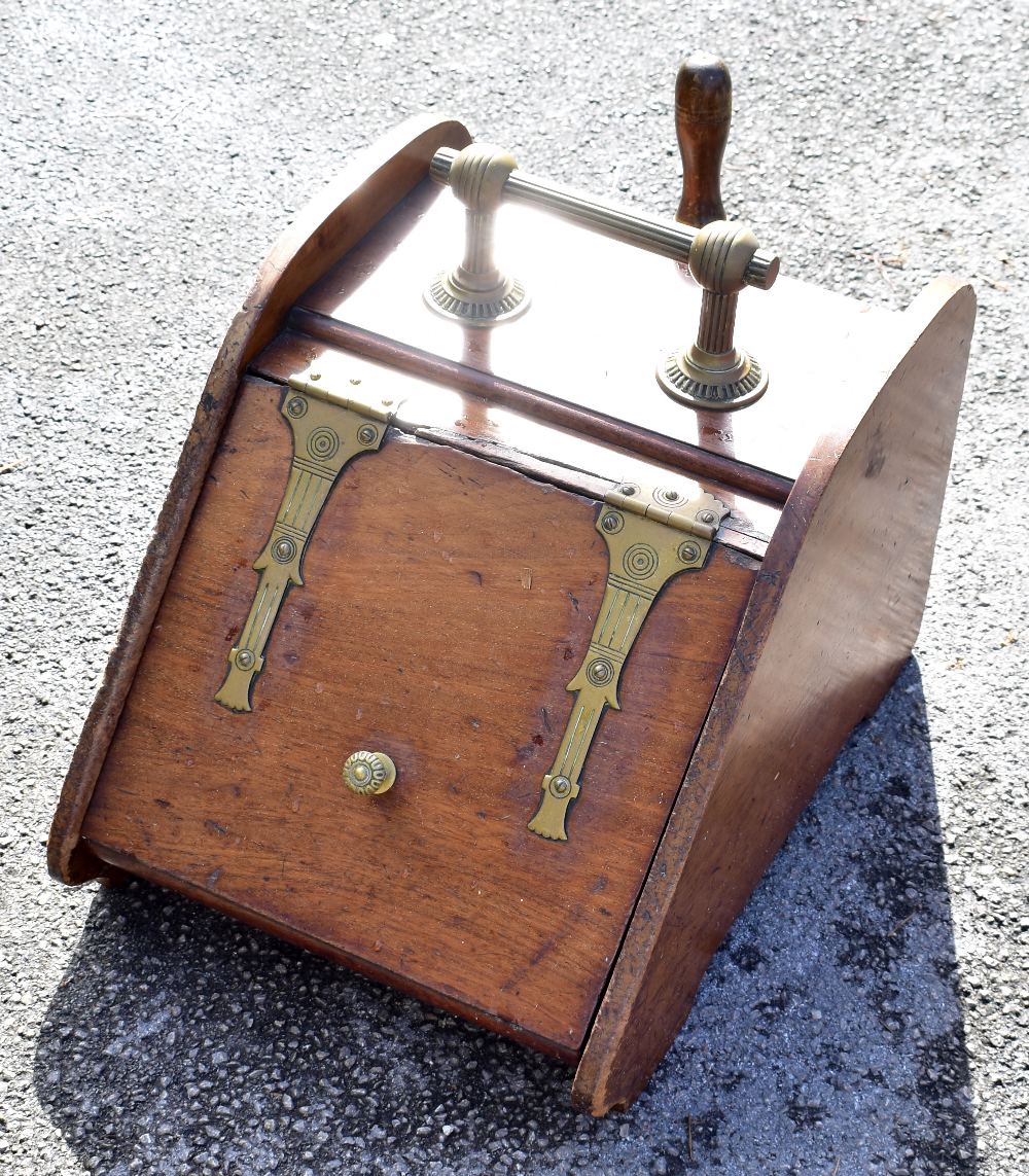 A late Victorian walnut and brass mounted coal scuttle with shovel.Additional InformationCracks