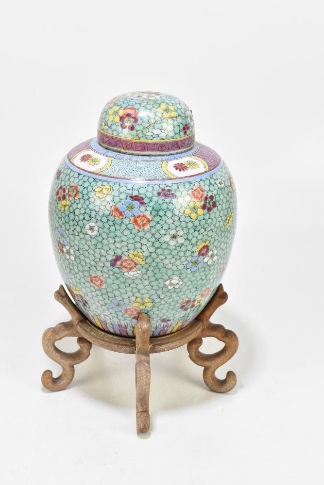 A late 19th century Chinese Famille Rose jar and cover, enamel painted with floral sprays on a - Image 5 of 8