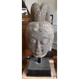 A very large and early Chinese carved stone head of Buddha on substantial custom made stand,