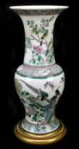 A 19th century Chinese Famille Verte vase, Guangxu mark and of the period, the body decorated with a