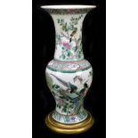 A 19th century Chinese Famille Verte vase, Guangxu mark and of the period, the body decorated with a