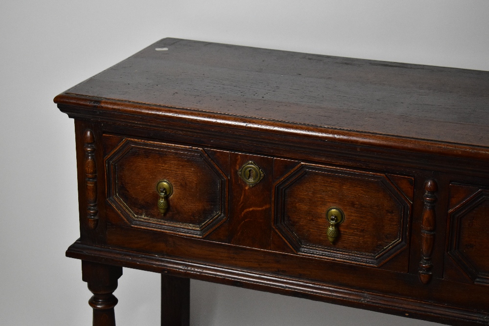 A 1920’s oak dresser base, of 17th century style, with two fielded drawers, on turned and block - Bild 2 aus 5