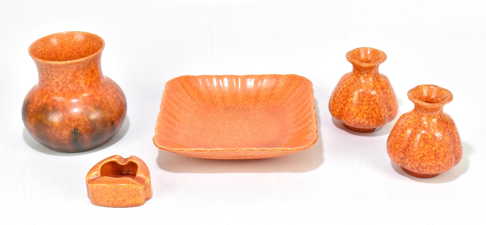 ROYAL LANCASTRIAN; five pieces decorated in an orange vermillion glaze including a pair of squat