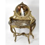 A decorative reproduction French style dressing table with oval bevelled mirror back above marble