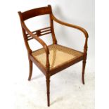 A Regency style strained beech chair, with caned seat, on faux bamboo legs (1)