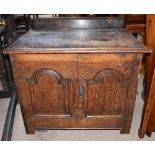 An small oak cabinet with pair of panel doors, probably constructed from coffer parts, width 71cm.