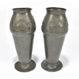 ARCHIBALD KNOX FOR LIBERTY & CO; a pair of pewter vases, no.02510, height 19.25cm. Provenance: