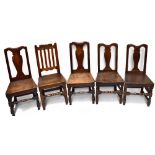 A set of four 19th century oak hall chairs, together with a further 19th century oak splat back hall