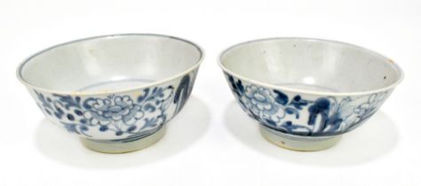 TEK SING CARGO; Two Chinese bowls painted with floral sprays in blue and white, diameter 17.25cm and