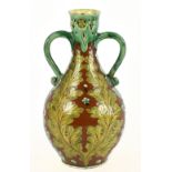 VIOLET WOOHOUSE FOR DELLA ROBBIA: an Art Pottery twin handled baluster shaped vase with floral