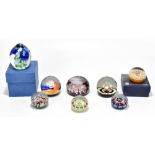 A collection of glass paperweights including Strathearn and Caithness examples, including a