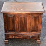 A small oak rectangular box with hinged lid above two base drawers, width 61cm.