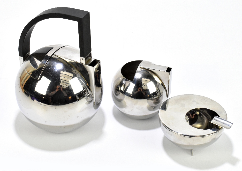 OLIVER HEMMING; a contemporary stainless steel teapot and similar cream jug of bulbous form,