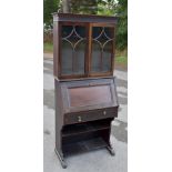 An Edwardian mahogany bureau bookcase, the upper section with moulded cornice and blind fret