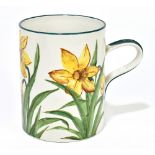 WEMYSS WARE; a hand painted oversized mug, decorated with daffodils, impressed marks and retailer