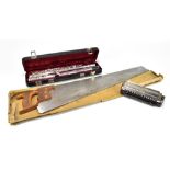 GRASSI, a Professional 2000 flute in fitted case, with a Hohner harmonica and a musical saw, (3).