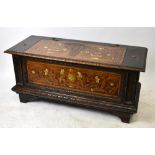 A 19th century Italian carved oak, marquetry and ivory inlaid cassone, the top and front panel