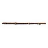 A 19th century rosewood flute with engraved white metal mounts, stamped 'Monzani & Co, 28 Regent