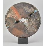 NICHOLAS MARSH; a large raku disc side fired on shells and mounted on slate, incised mark dated