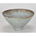 Attributed to ABDO NAGI (1941-2001); a conical stoneware bowl covered in mottled blue/grey glaze