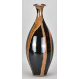 PETER SPARREY (born 1967); a tall stoneware bottle covered in tenmoku glaze with illemite pours,