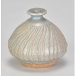 KATHARINE PLEYDELL-BOUVERIE (1895-1985); a small fluted stoneware bud vase covered in blue/grey