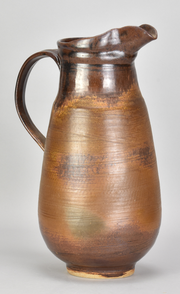 ABDO NAGI (1941-2001); a tall stoneware jug covered in iron glaze, impressed marks, made 2000,