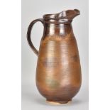 ABDO NAGI (1941-2001); a tall stoneware jug covered in iron glaze, impressed marks, made 2000,